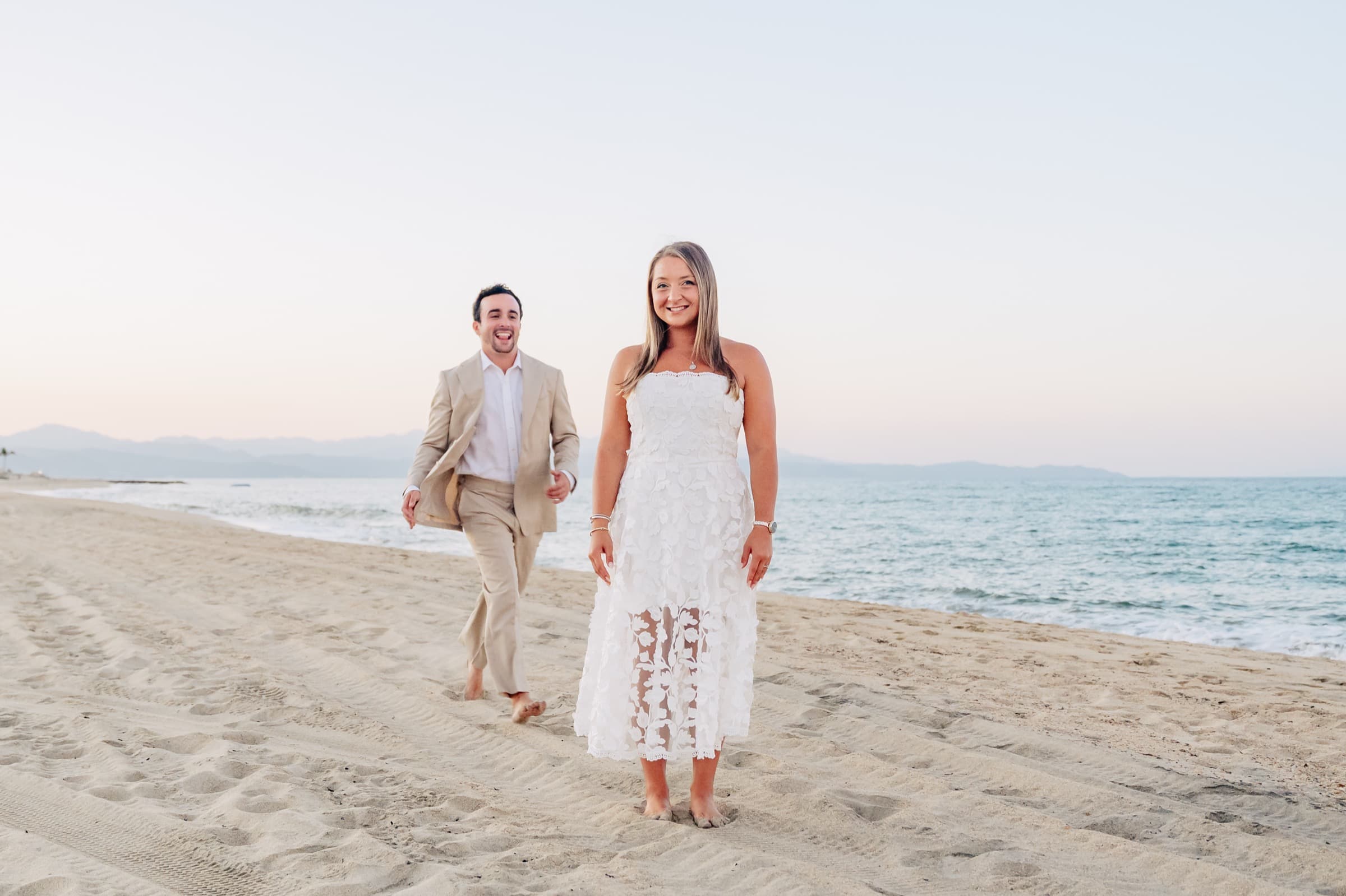 Taylor and Jeffrey walking on the beach