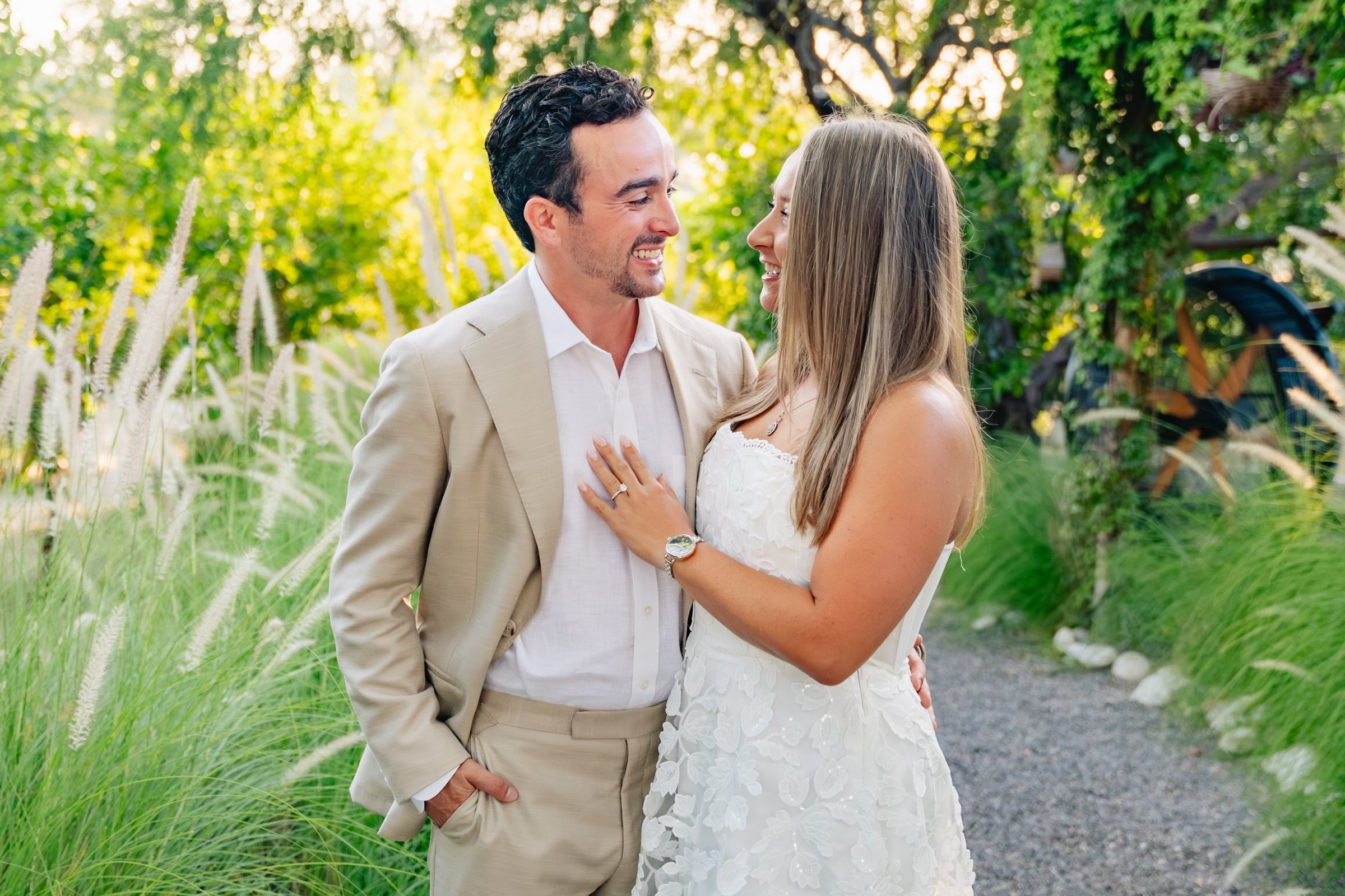 Taylor and Jeffrey laughing in garden at golden hour